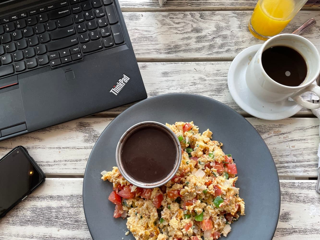 Breakfast at Sinaloa 177, CDMX. Egg scramble, coffee, juice, and beans.